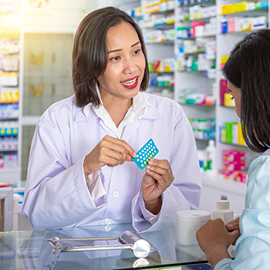 Pharmacist consulting with a patient