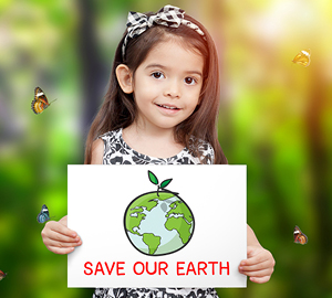 Young girl holding a Save Our Earth sign.