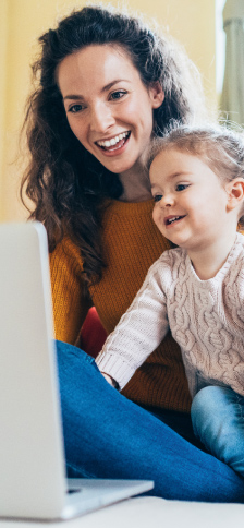 Mother and daughter looking at computer