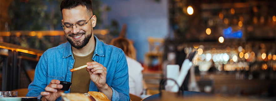 Franchise business loan image - Customer eating fries