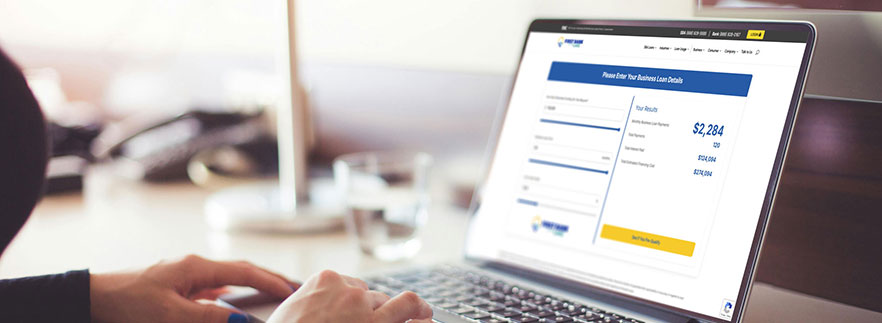 Business person using a business loan calculator - Buy a Business Loan