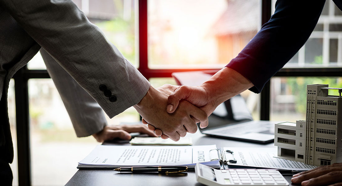 Shaking hands - Commercial Loan Calculator