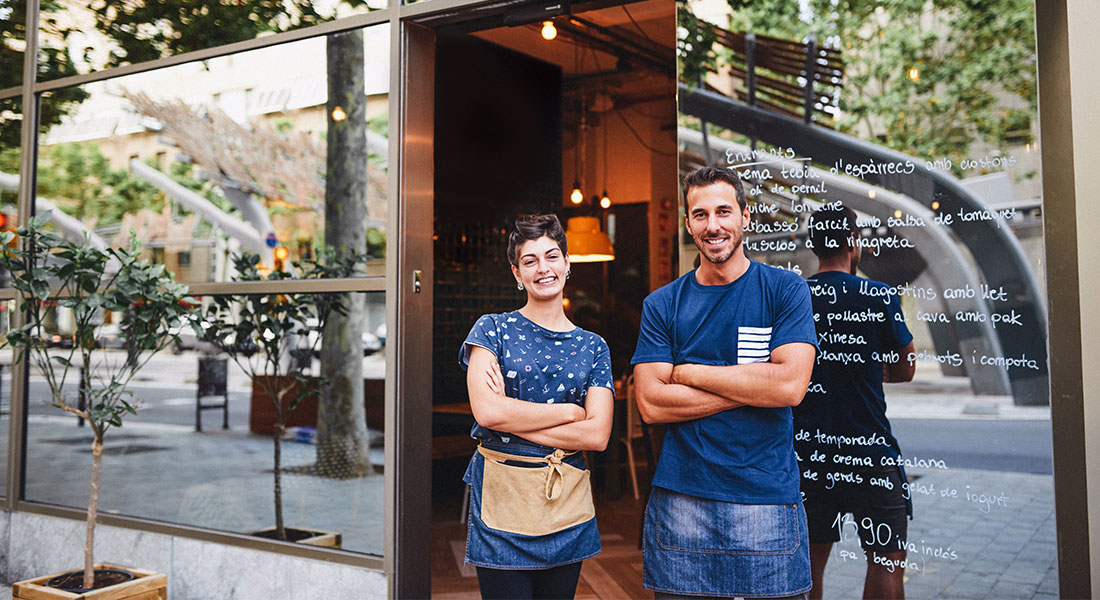 Franchise owners outside their shop - List of top franchise examples