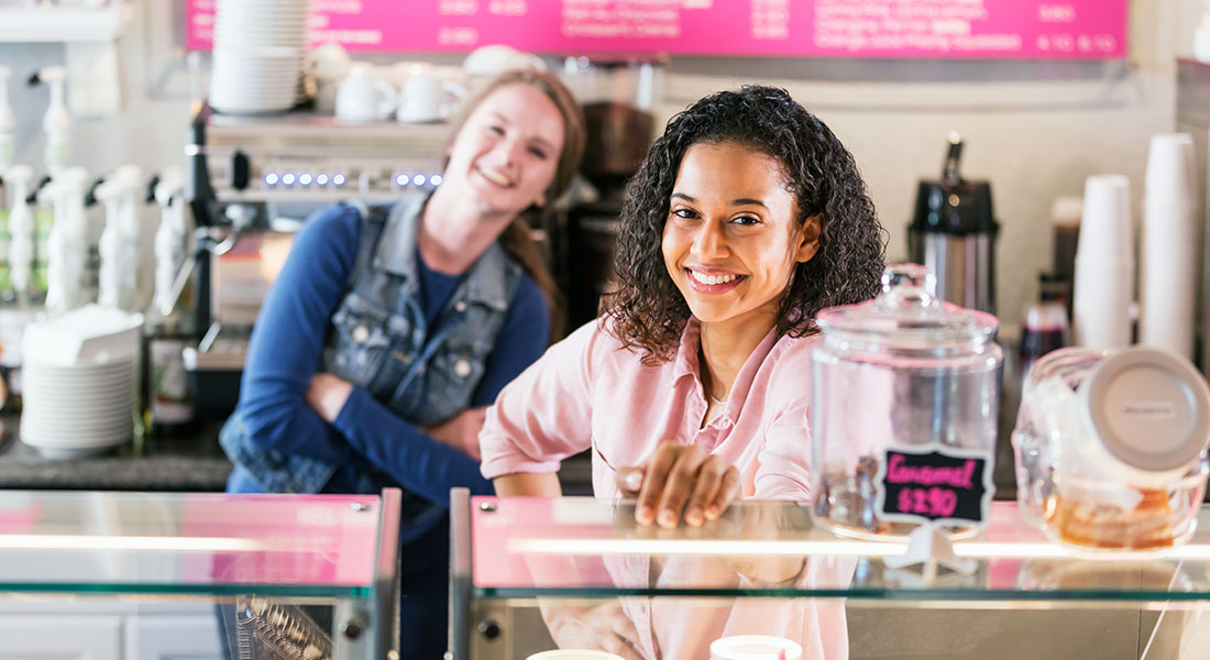 Workers behind counter at bakery franchise - Franchise Model