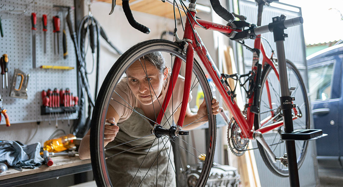 Bike shop owner working on a bike - SBA 7a Down Payment