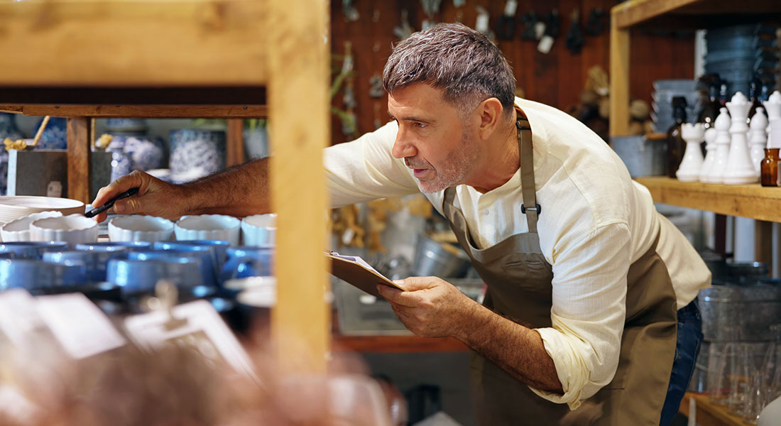 Shop owner looking at merchandise - SBA 7a Down Payment