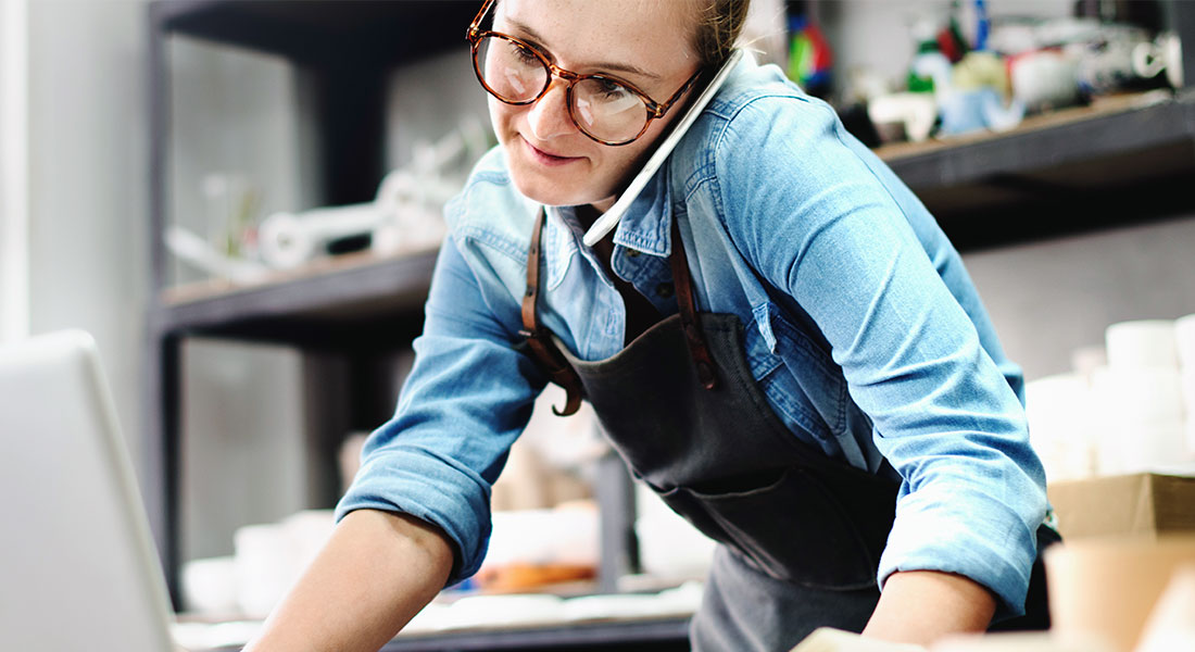 Shop owner on the phone - SBA 7a Down Payment