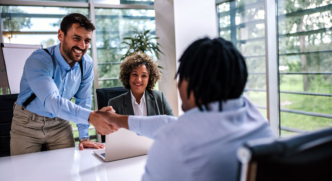 Business people shaking hands - SBA 7a Loan Programs